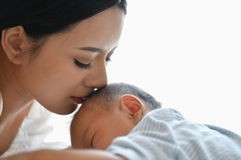 Newborn baby with mother